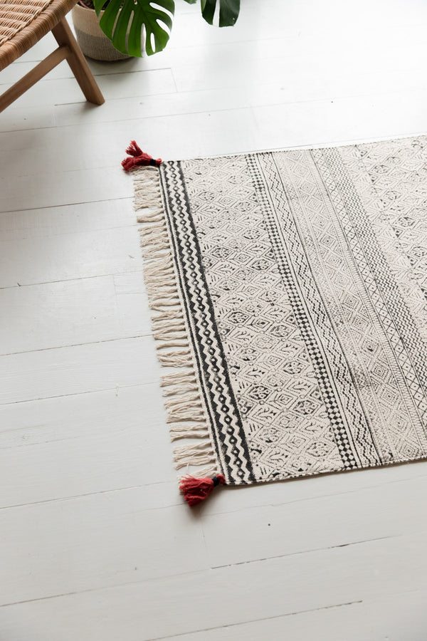Black & White Hand Block Printed Cotton Rug With Red Tassels