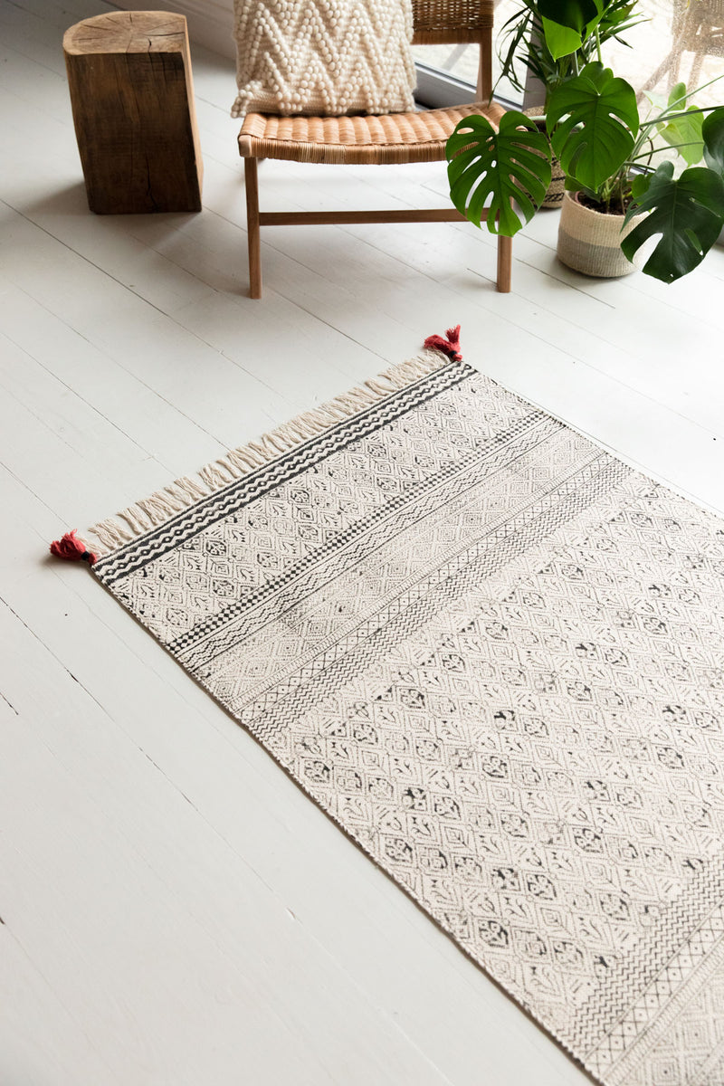 Black & White Hand Block Printed Cotton Rug With Red Tassels